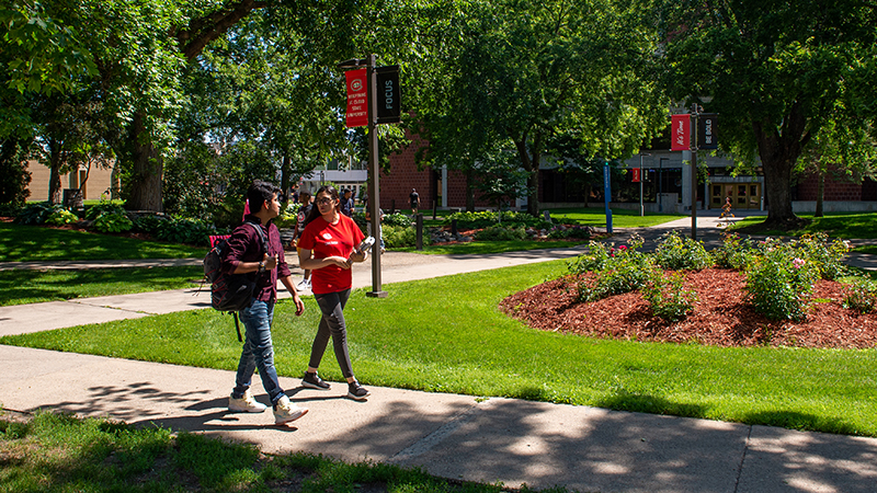Students walking on sidewalk
